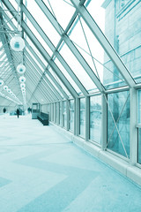 contemporary illuminated hall, people moving