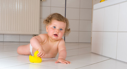 baby with rubber duck