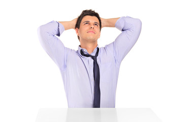 A young satisfied businessman looking above