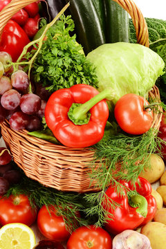 Composition with raw vegetables in wicker basket