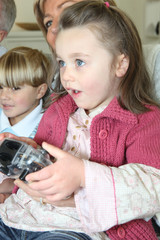 Girl playing console © auremar