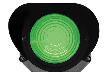 Green light railway traffic dwarf signal set at go ahed, isolate