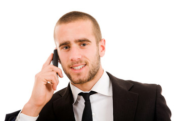 Smiling young business man on the phone, isolated on white