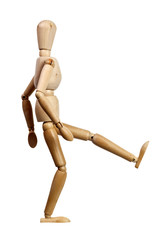 Wooden mannequin kicking isolated on white