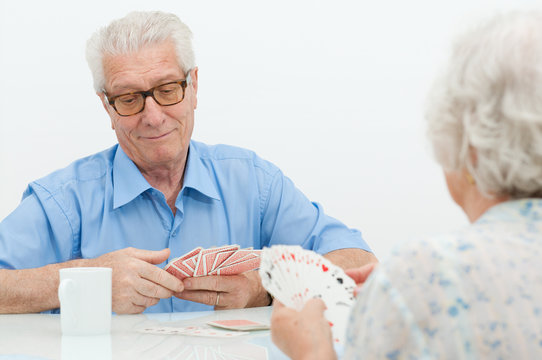 Senior Couple Playing With Cards