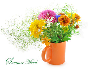 Beautiful summer flowers in an orange mug