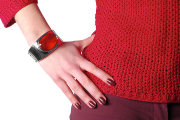 female hand wearing bangle touching the waist