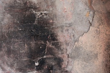 Close up of a  wall with soot and fire damages