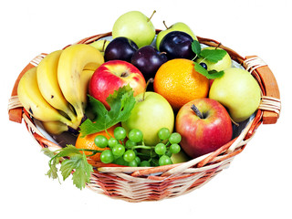 Basket of assorted fresh fruit, isolated over white - healthy fo