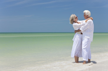 Happy Senior Couple Embracing on A Tropical Beach