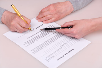 elderly woman writing testament