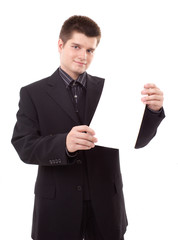 Young man holding blank white board, portrait