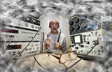 Funny nerd scientist soldering at vintage laboratory