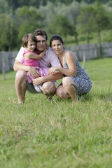 Fototapeta premium beautiful family posing in nature