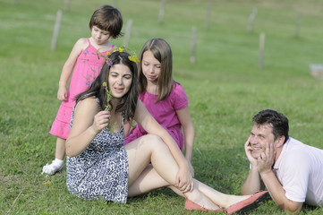 beautiful family relaxing in summer season