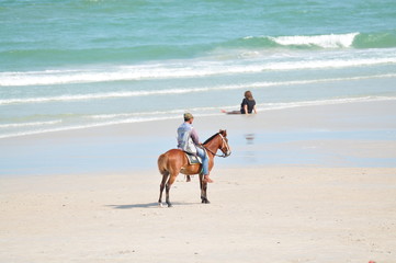 Horse riding on the beach at Hua Hin, south of Thailand