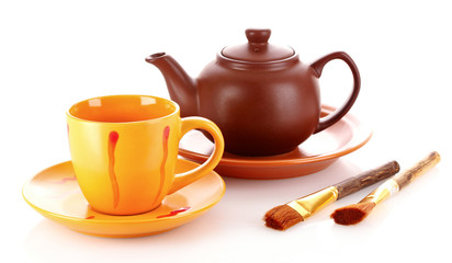 Tea brush, cup and teapot isolated on a white background