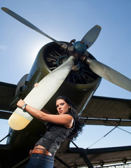 woman in jeans and aircraft