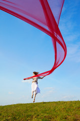 beautiful hippie girl with red fabric