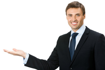 Businessman showing blank area for sign or copyspase, isolated