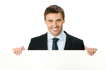Happy business man showing blank signboard, isolated