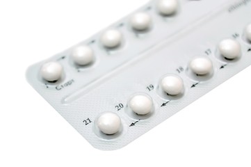 Birth control pills on white