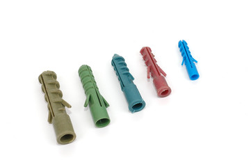 Colored rawl plugs on white background