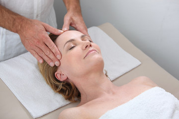 Fototapeta na wymiar Blond woman receiving massage
