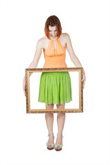 young girl in bright clothes holding decorative picture frame, i