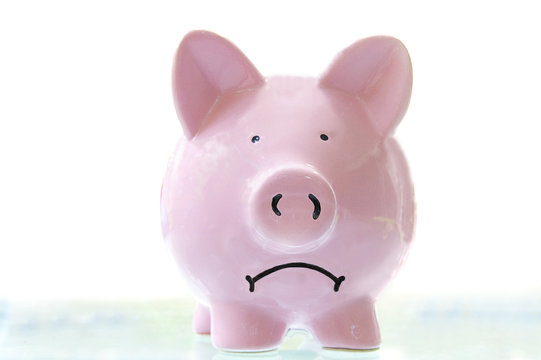 frowning pink piggy bank, on white