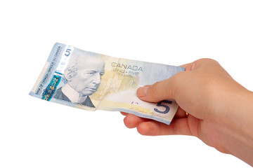 Female hand holding Canadian money