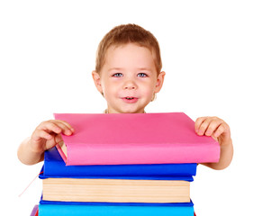 Child holding stack of books.