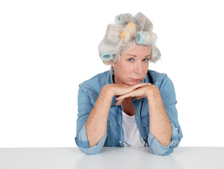 Portrait of senior woman with hair curlers