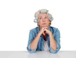 Portrait of senior woman with hair curlers