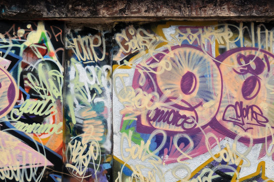grunge urban wall with messy graffiti tags