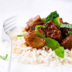 Beef goulash with mushrooms and broccoli on rice