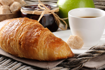 Breakfast with coffee, french croissant and jam
