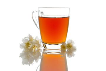 tea with jasmine in transparent mug