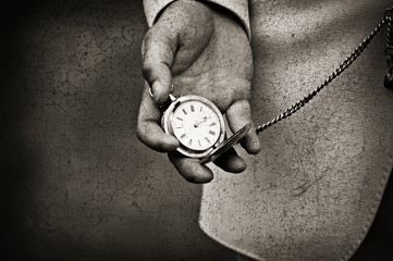 Old watch in the hands. Time concept