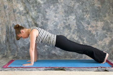 woman doing Yoga posture Plank pose
