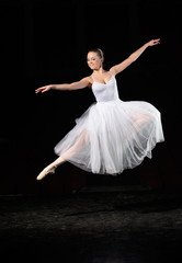 Fototapeta na wymiar Portrait of young ballerina in rehearsal