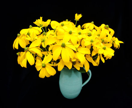 Fototapeta Vase with yellow, but green headed, Rudbeckia flowers