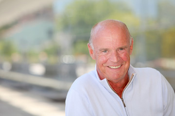 Portrait of handsome senior man with blue sweater