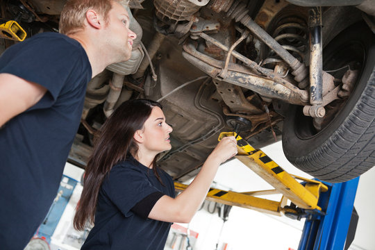Two Mechanics Discussing Problem