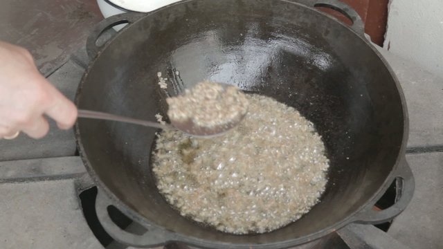 EDIT Collecting chicken fat with slotted spoon