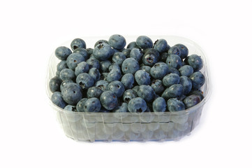 Blueberries in the basket at white background