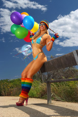 Sexy bikini girl with colorful balloons
