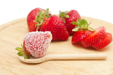 strawberries on a board isolated on white