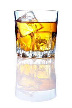 Whiskey glass with ice cubes and reflections