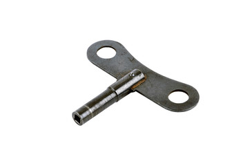 Old vintage rusty key for clock, isolated on white background